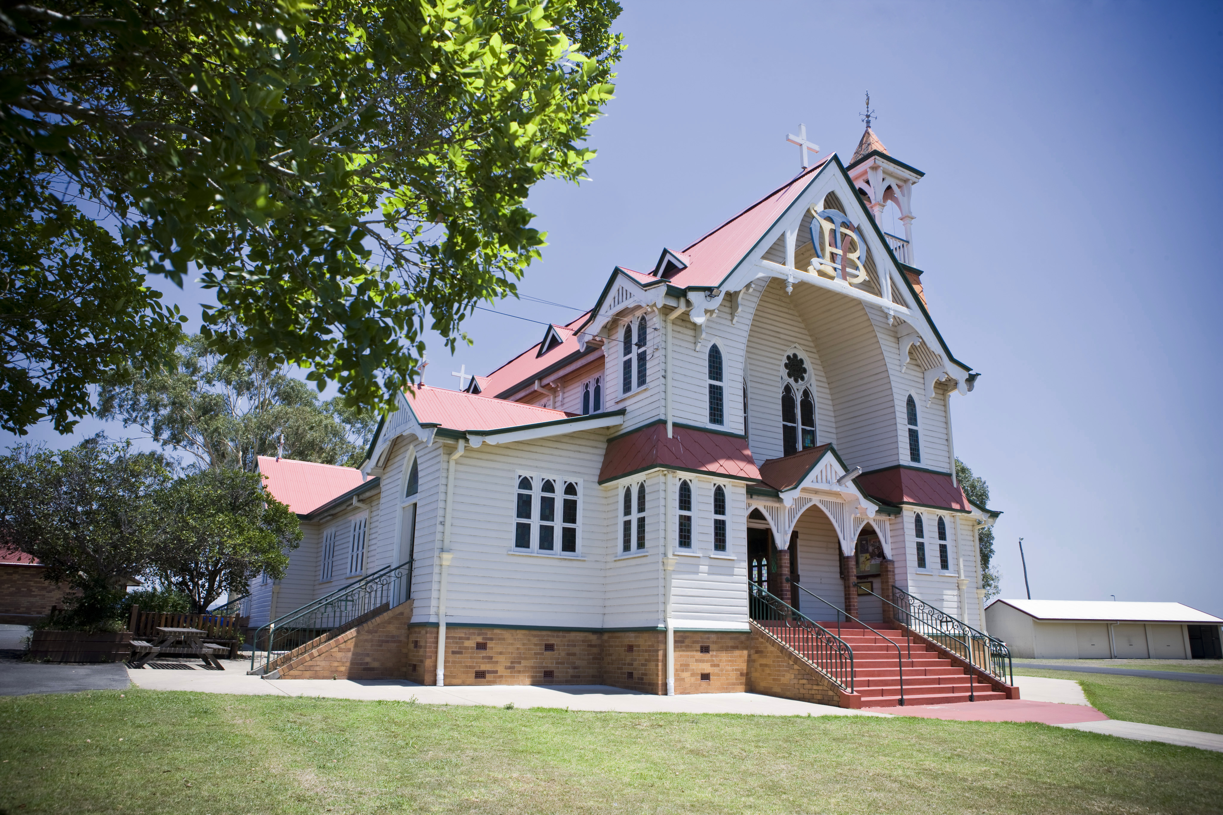 Exterior of St Mary’s church with traditional design and cross, representing faith, worship and connection to the school community