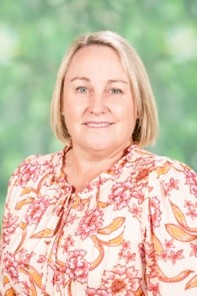 School principal portrait representing leadership, approachability and commitment to the school community Provide your feedback on BizChat